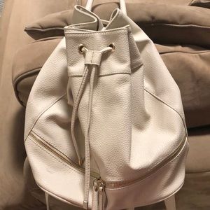 Cream colored mini backpack